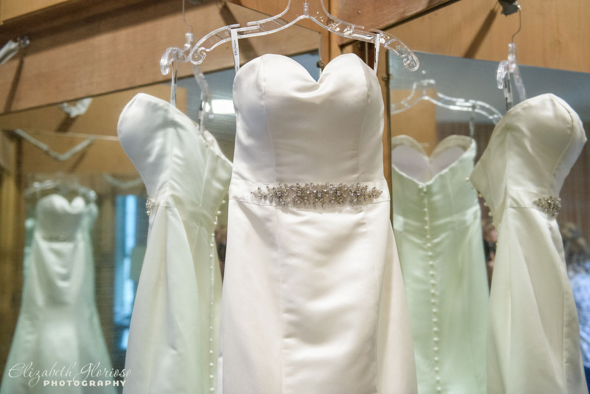 Photo of wedding and bridesmaid dresses hung up