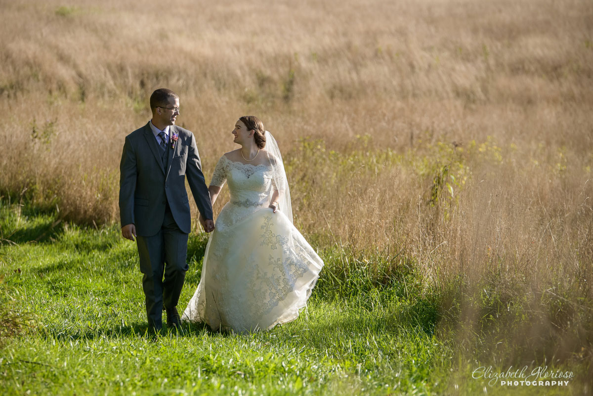 Photo of bride and groom walking hand-in-hand taken in Burton, Ohio